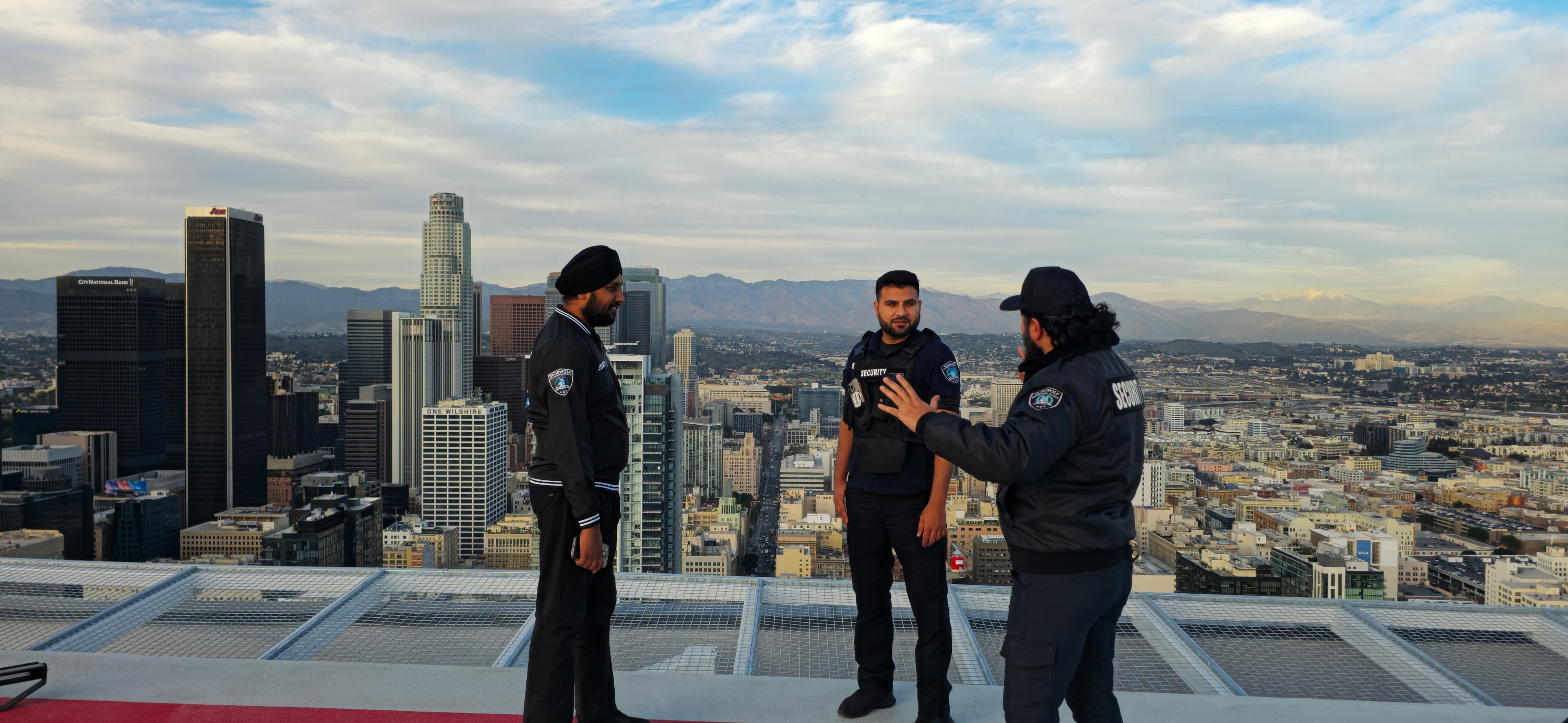 BlueWolf security officers overlooking the California skyline at dusk