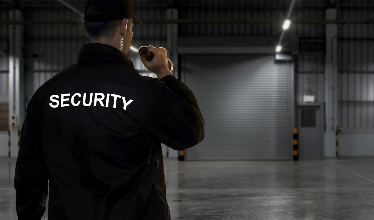 “Professional security guard in uniform providing safety and protection at a commercial property in Southern California.